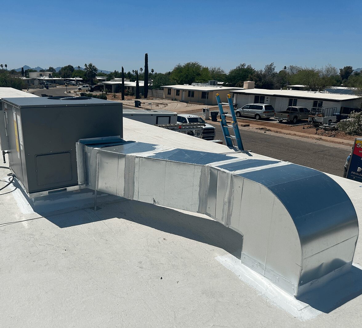 Rooftop HVAC unit with metal ductwork installed.