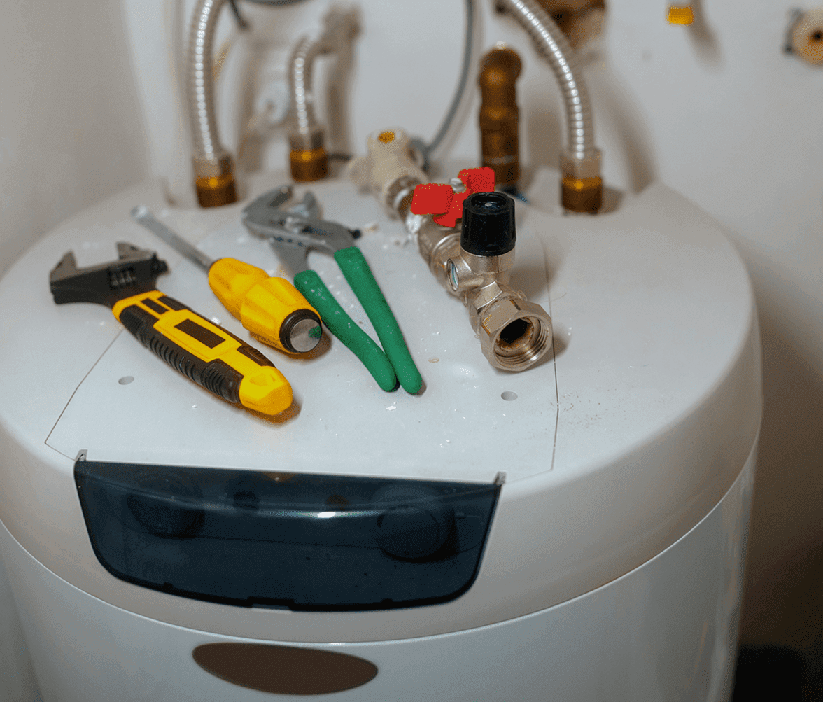 Tools on top of a water heater.