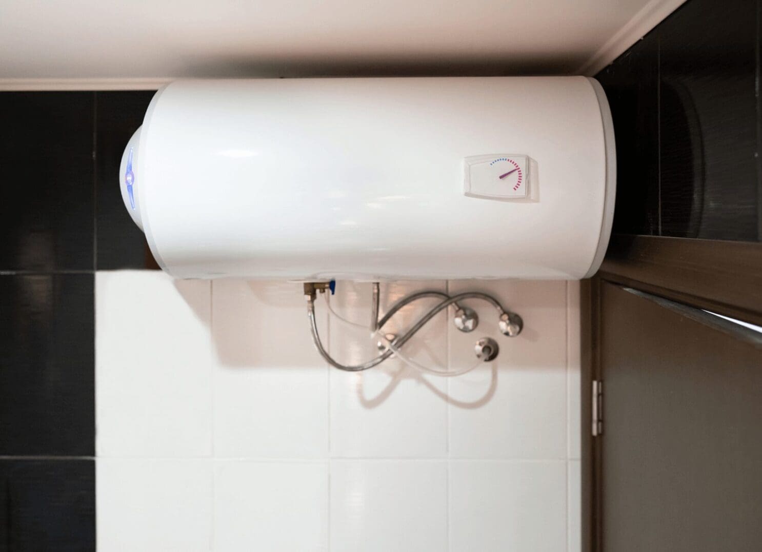 White wall-mounted electric water heater.