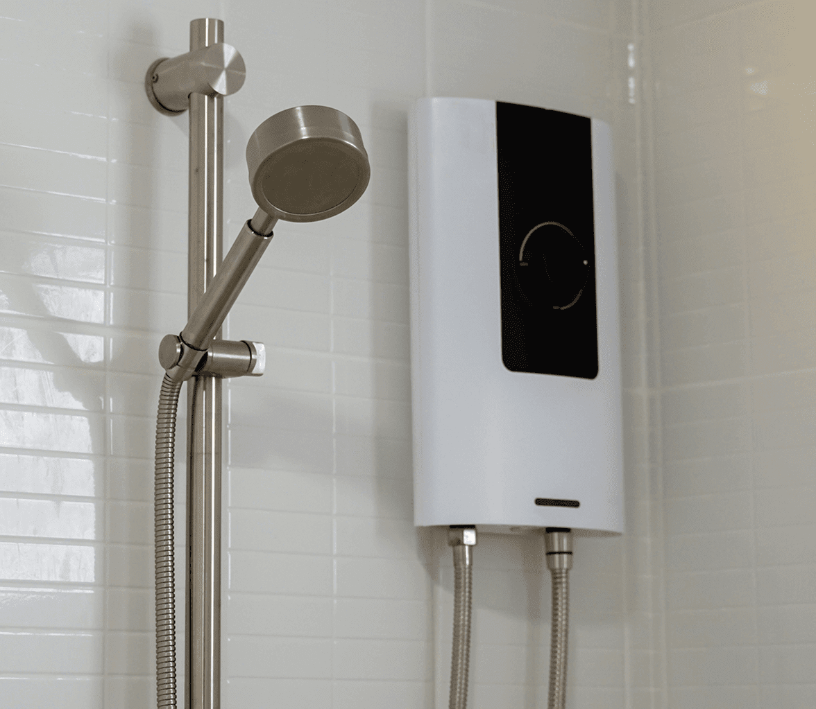 Showerhead and water heater on tiled wall.